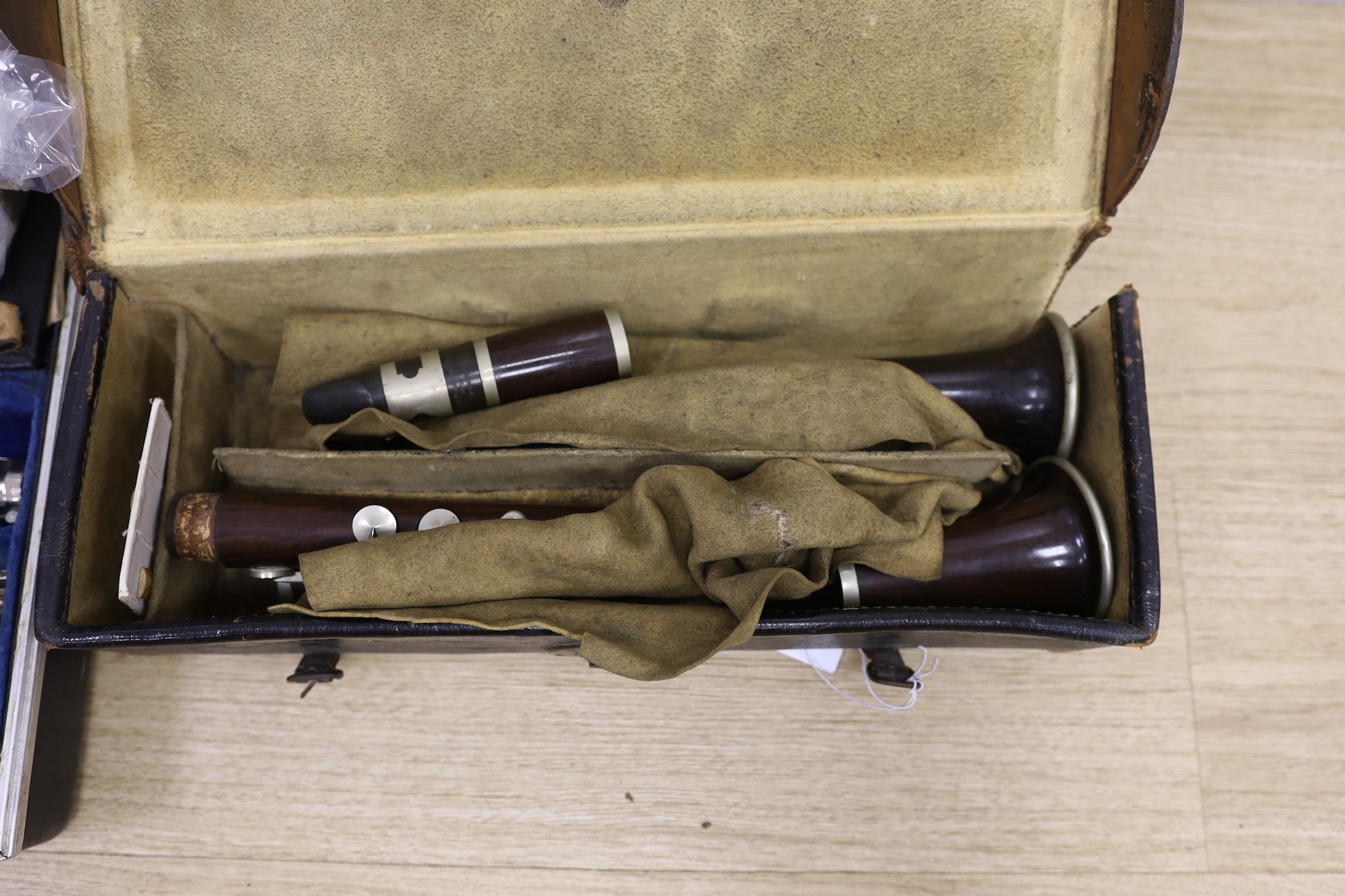 A French Buffet clarinet and two 19th century 'Simple System' clarinets, cased as one